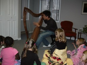 Andrew tells stories about the harp