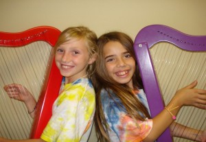 Youngsters exploring the harp for the first time.